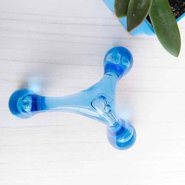 Masajeador traslucido 3 puntas, 9 x 8.5 cmts